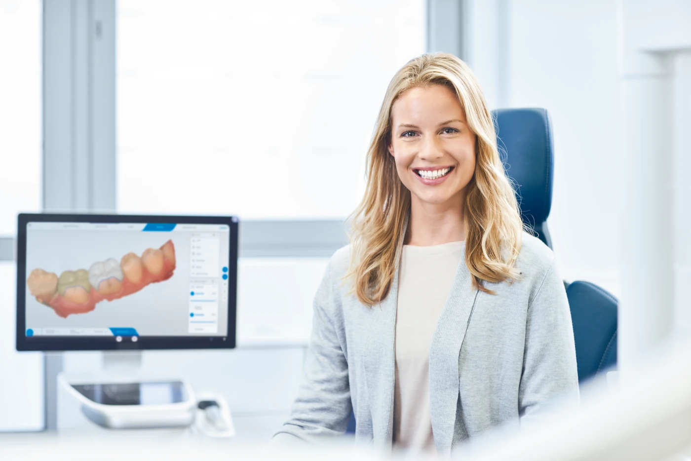 female dentist smiling into camera